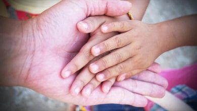 hands-of-adult-and-child-together